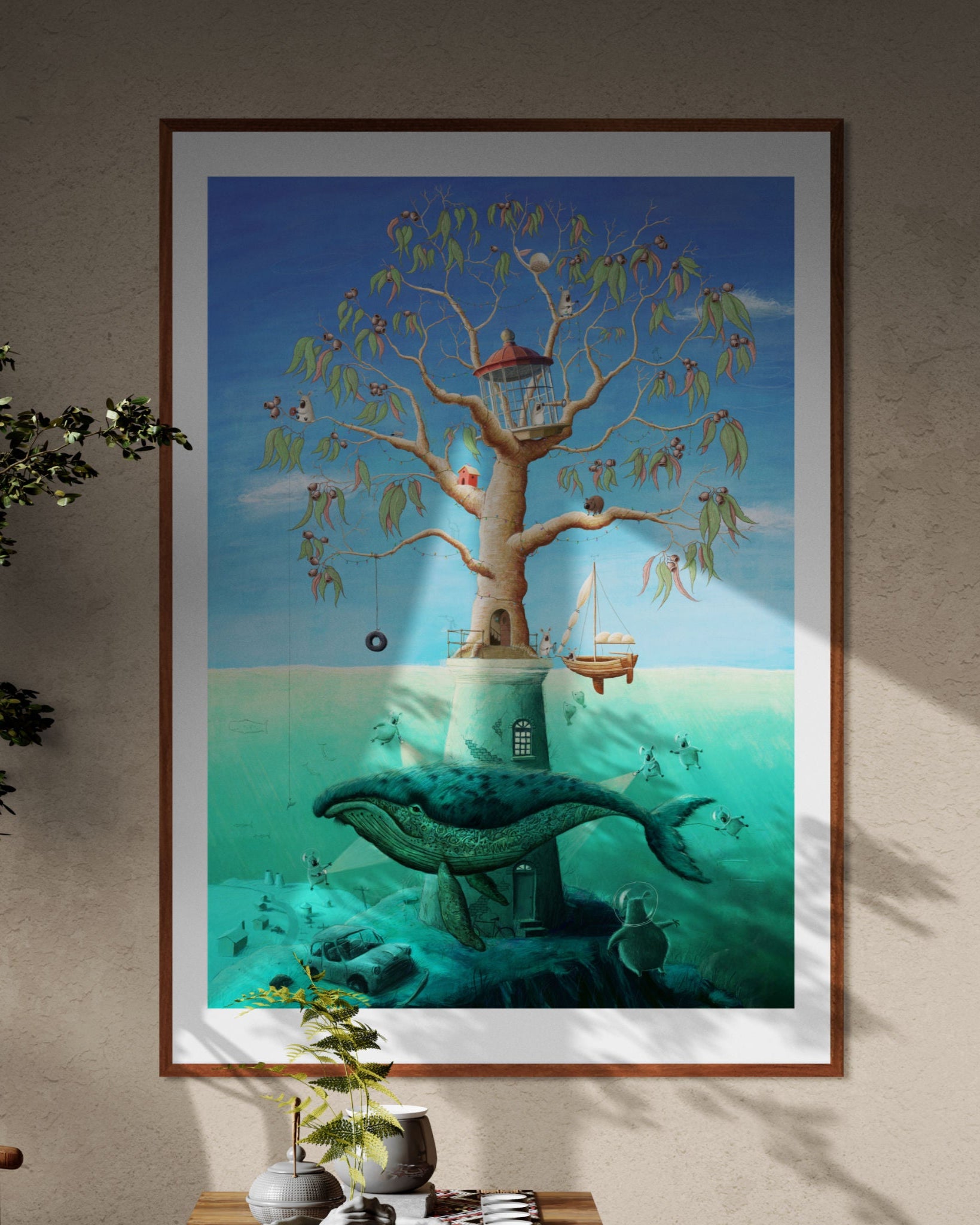 Framed artwork of a surreal scene with a tree, lantern, and whale in an underwater setting.